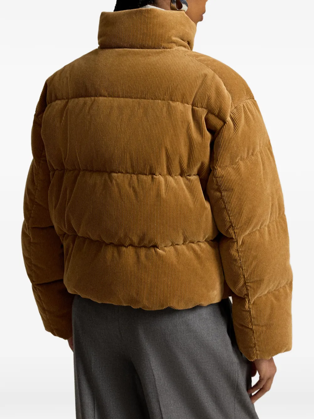Tan jacket worn by a person, showing the jacket fit