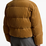 Tan jacket worn by a person, showing the jacket fit