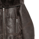 Close up of brown coat,showing texture of the leather fabric.