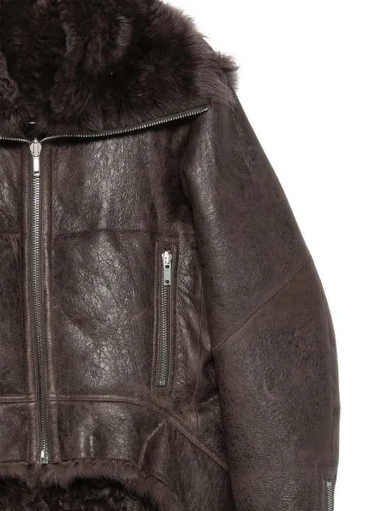 Close up of brown coat,showing texture of the leather fabric.