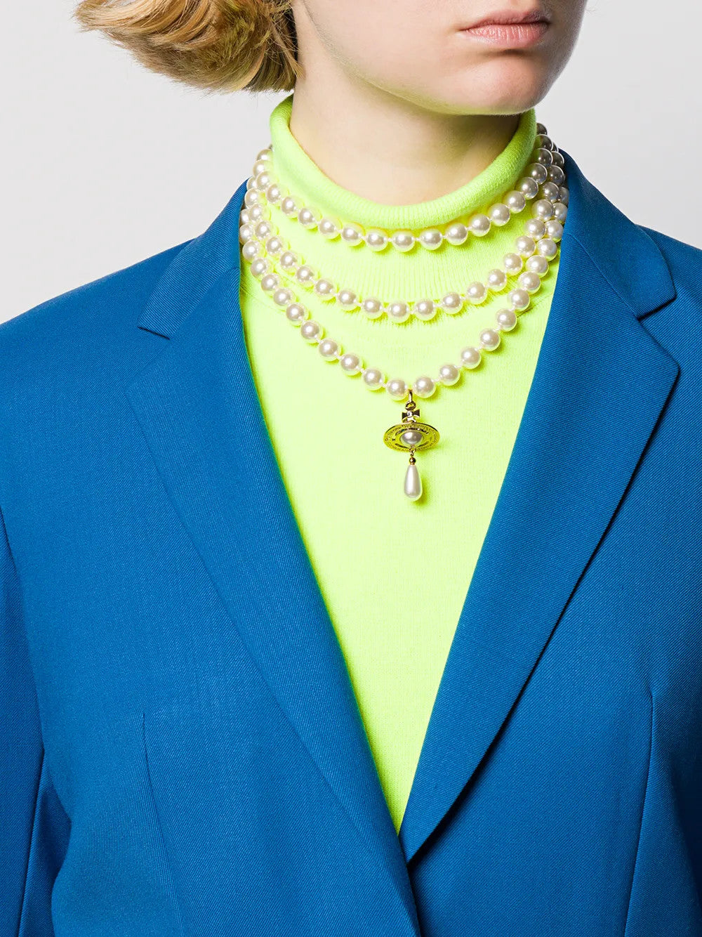 Tan jewelry worn by a person, showing the jewelry fit