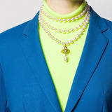 Tan jewelry worn by a person, showing the jewelry fit
