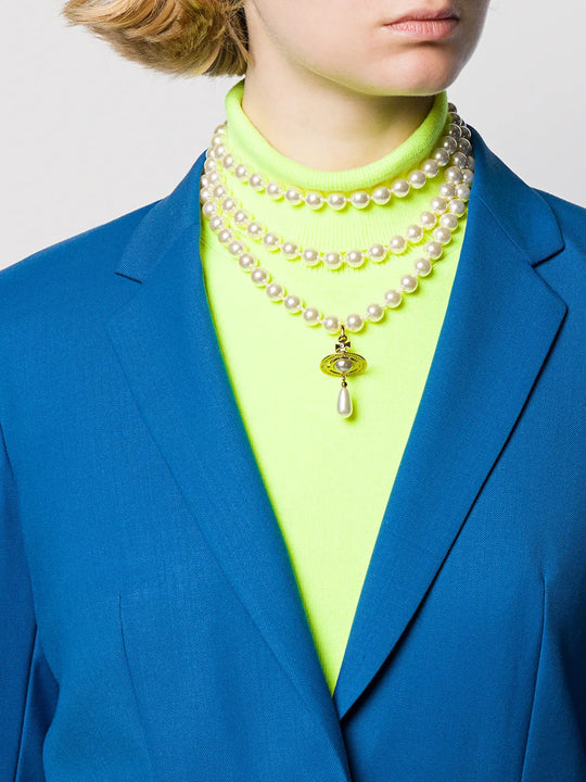 Tan jewelry worn by a person, showing the jewelry fit