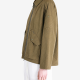 Brown jacket worn by a person, showing the jacket fit