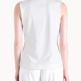White top worn by a person, showing the top fit