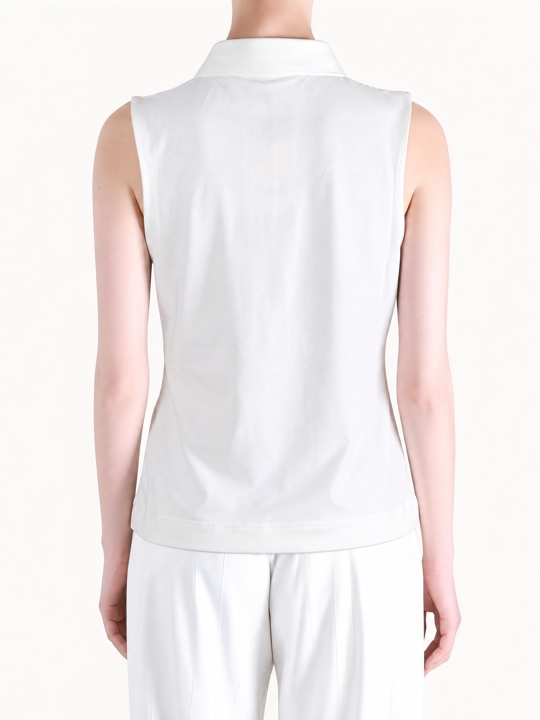 White top worn by a person, showing the top fit