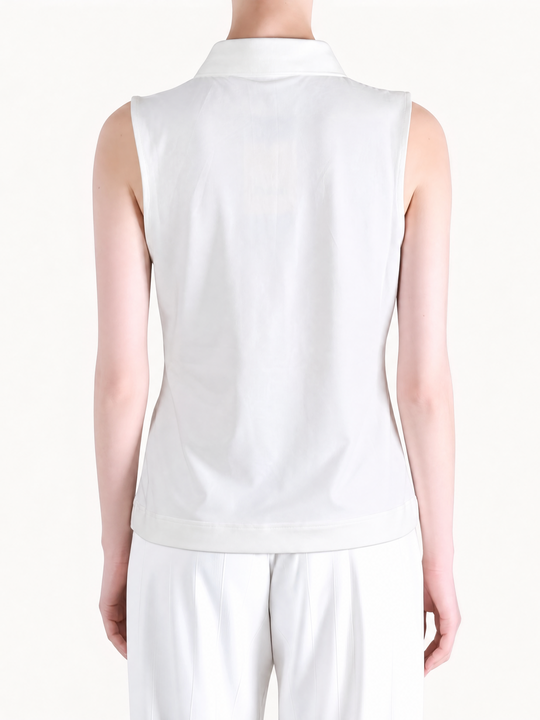 White top worn by a person, showing the top fit