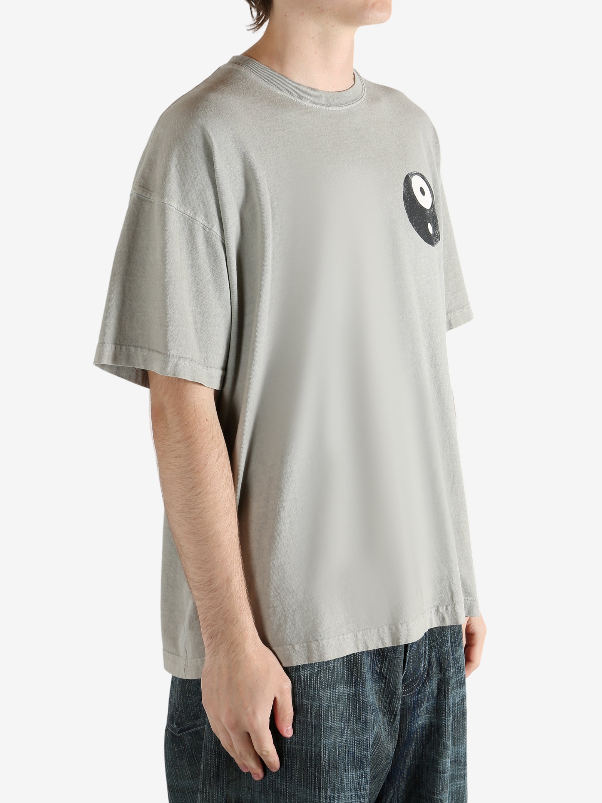 Gray t-shirt worn by a person, showing the shirt's fit