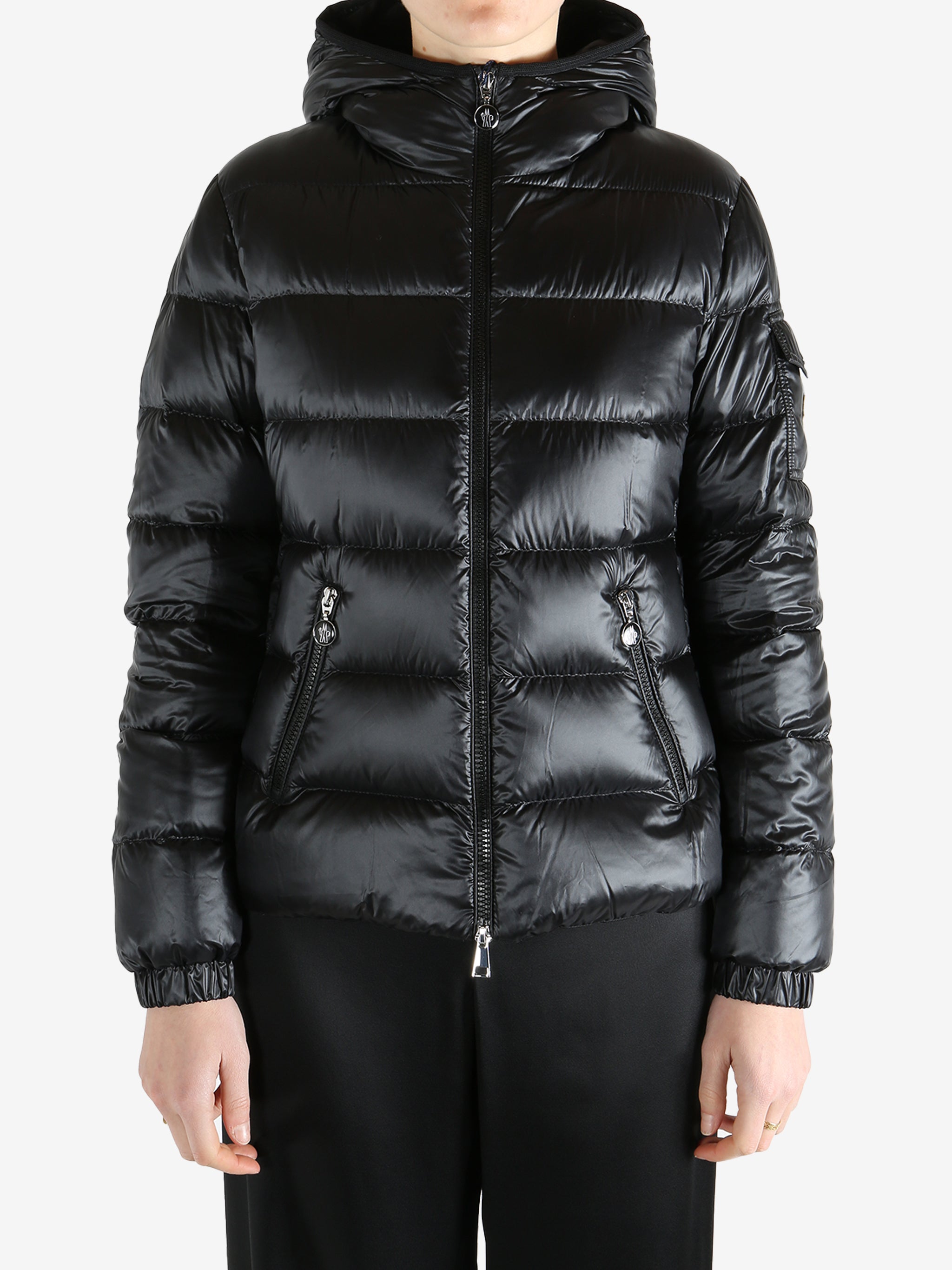 Black jackets-coats worn by a person, showing the jackets-coats fit