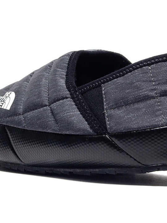 Close up of grey shoes, showing texture of the fabric