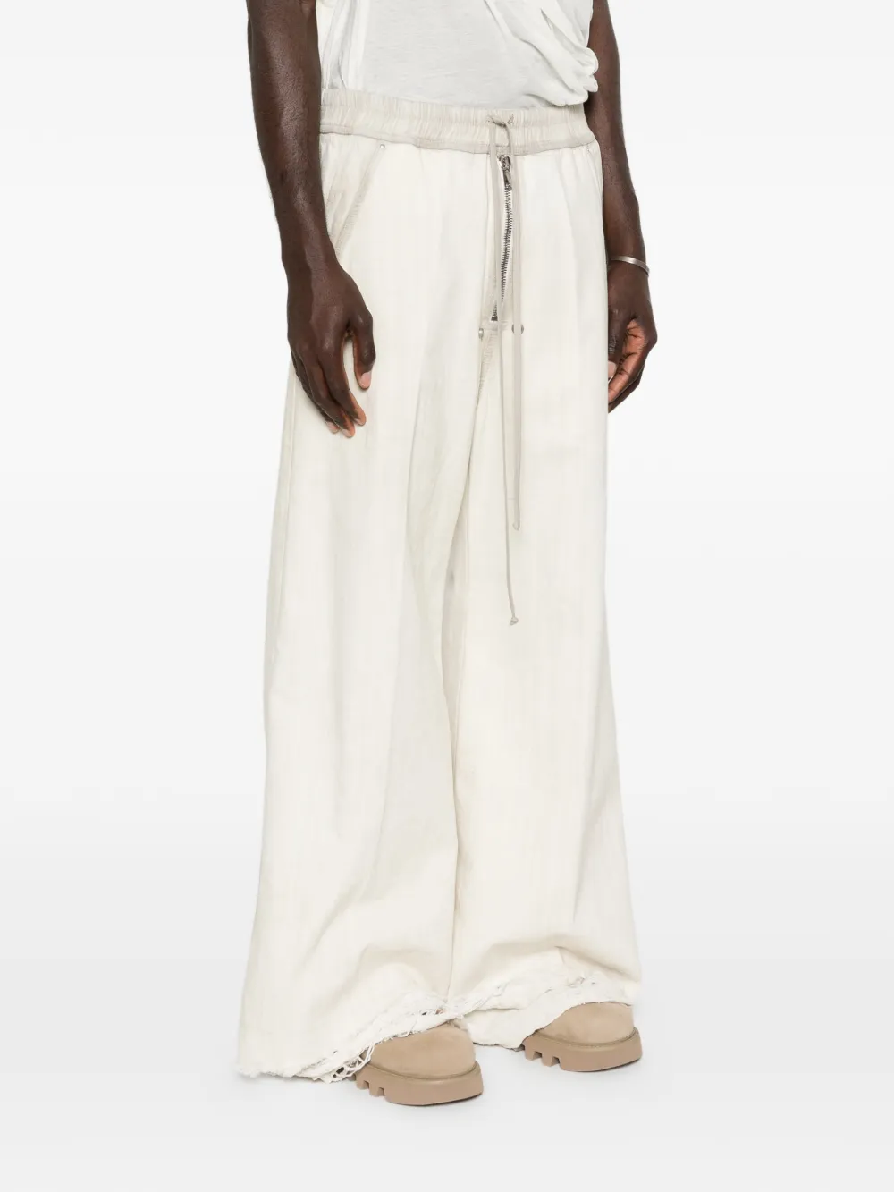 White pant worn by a person, showing the pant fit