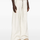 White pant worn by a person, showing the pant fit