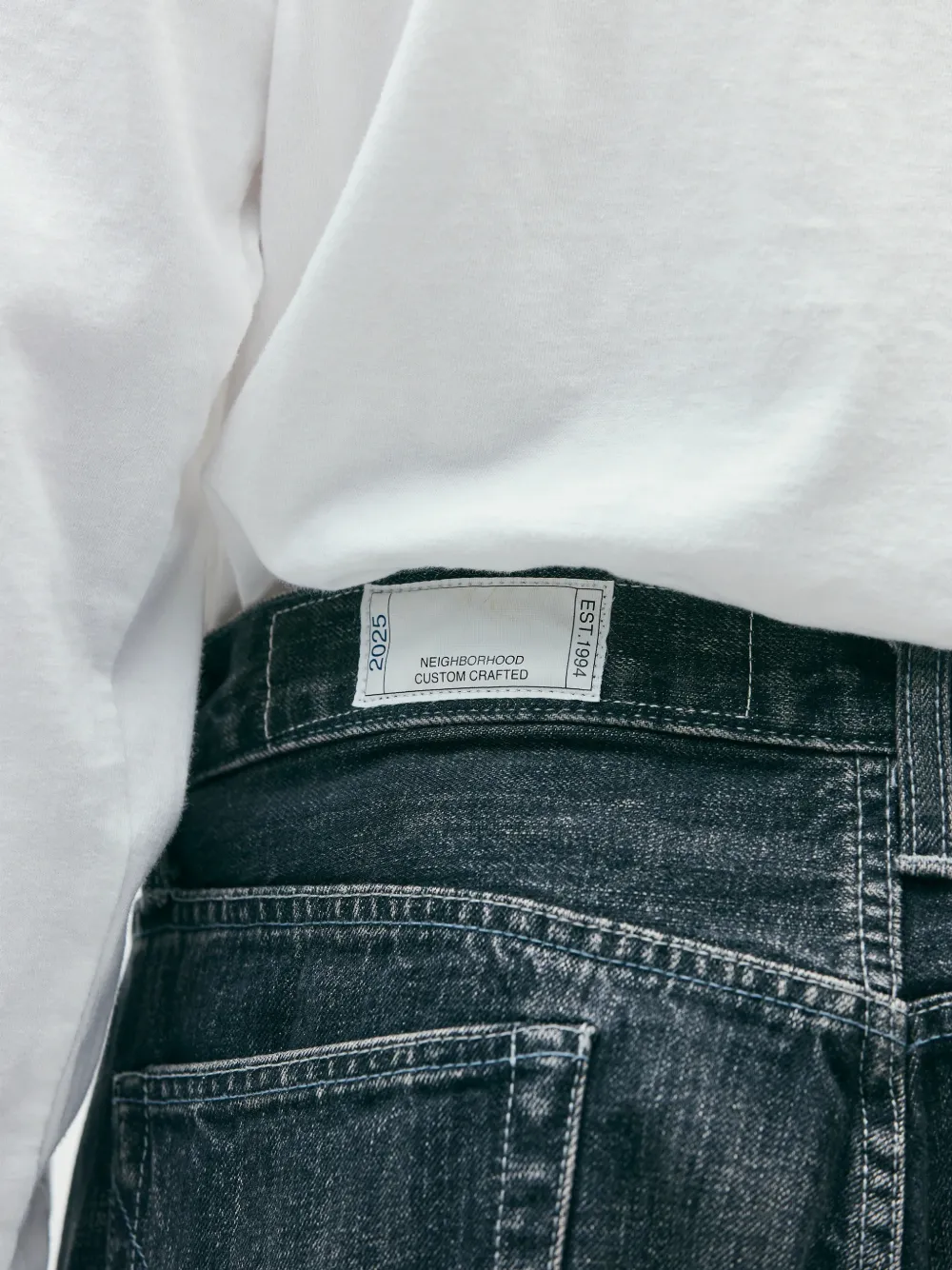 Close up of blue pants, showing texture of the cotton fabric