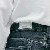 Close up of blue pants, showing texture of the cotton fabric