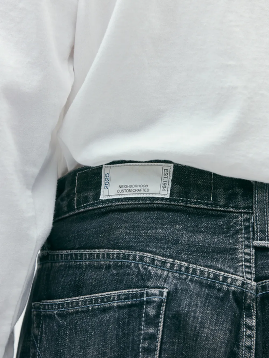 Close up of blue pants, showing texture of the cotton fabric