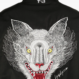 Close up of black jacket, showing texture of the cotton fabric