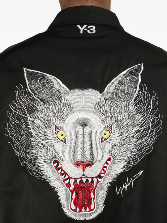 Close up of black jacket, showing texture of the cotton fabric