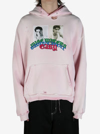 Pink sweatshirt worn by a person, showing the sweatshirt fit