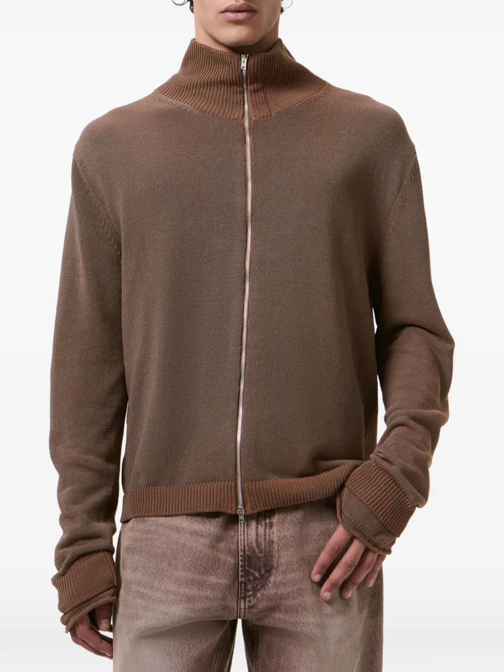 Brown sweater worn by a person, showing the sweater fit