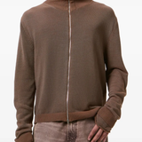 Brown sweater worn by a person, showing the sweater fit