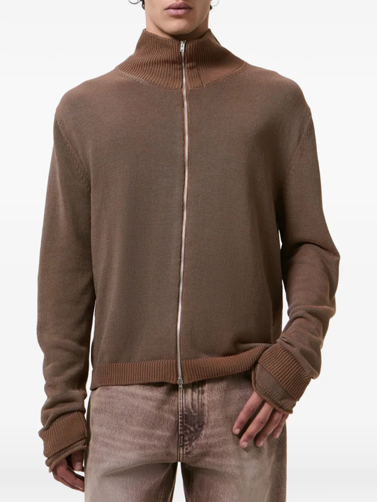 Brown sweater worn by a person, showing the sweater fit