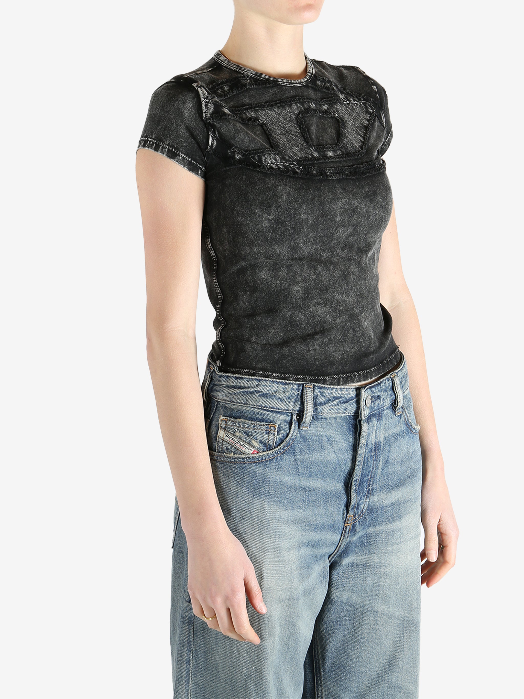 Black top worn by a person, showing the fit