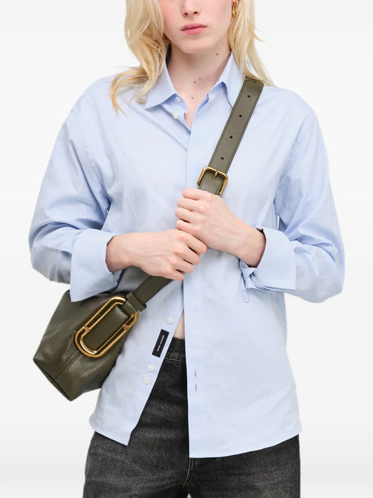Green bag worn by a person, showing the bag fit