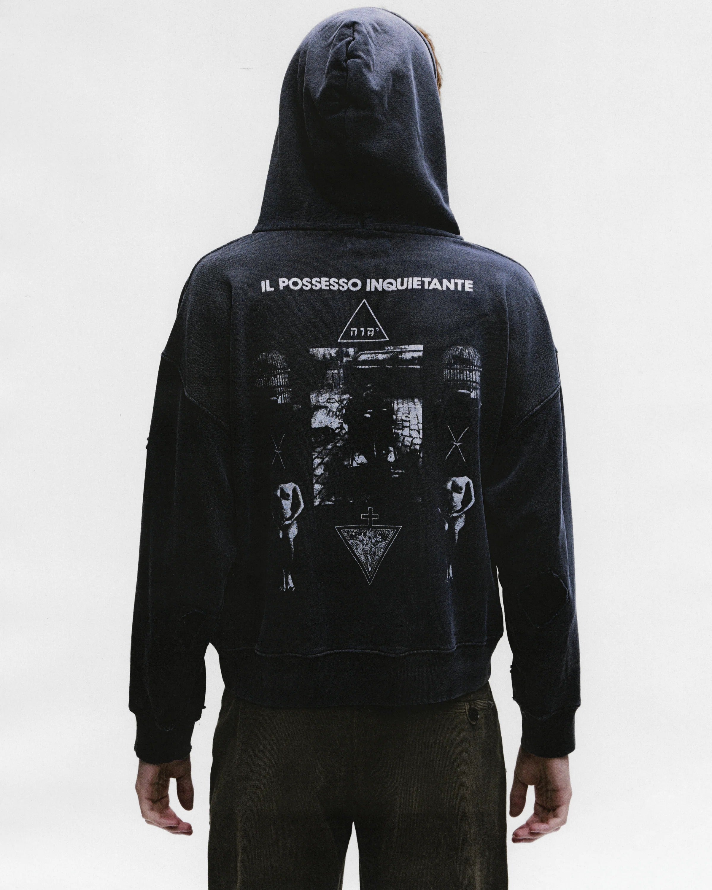 Black hoodies worn by a person, showing the hoodies fit