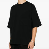 Black t-shirt worn by a person, showing the t-shirt fit
