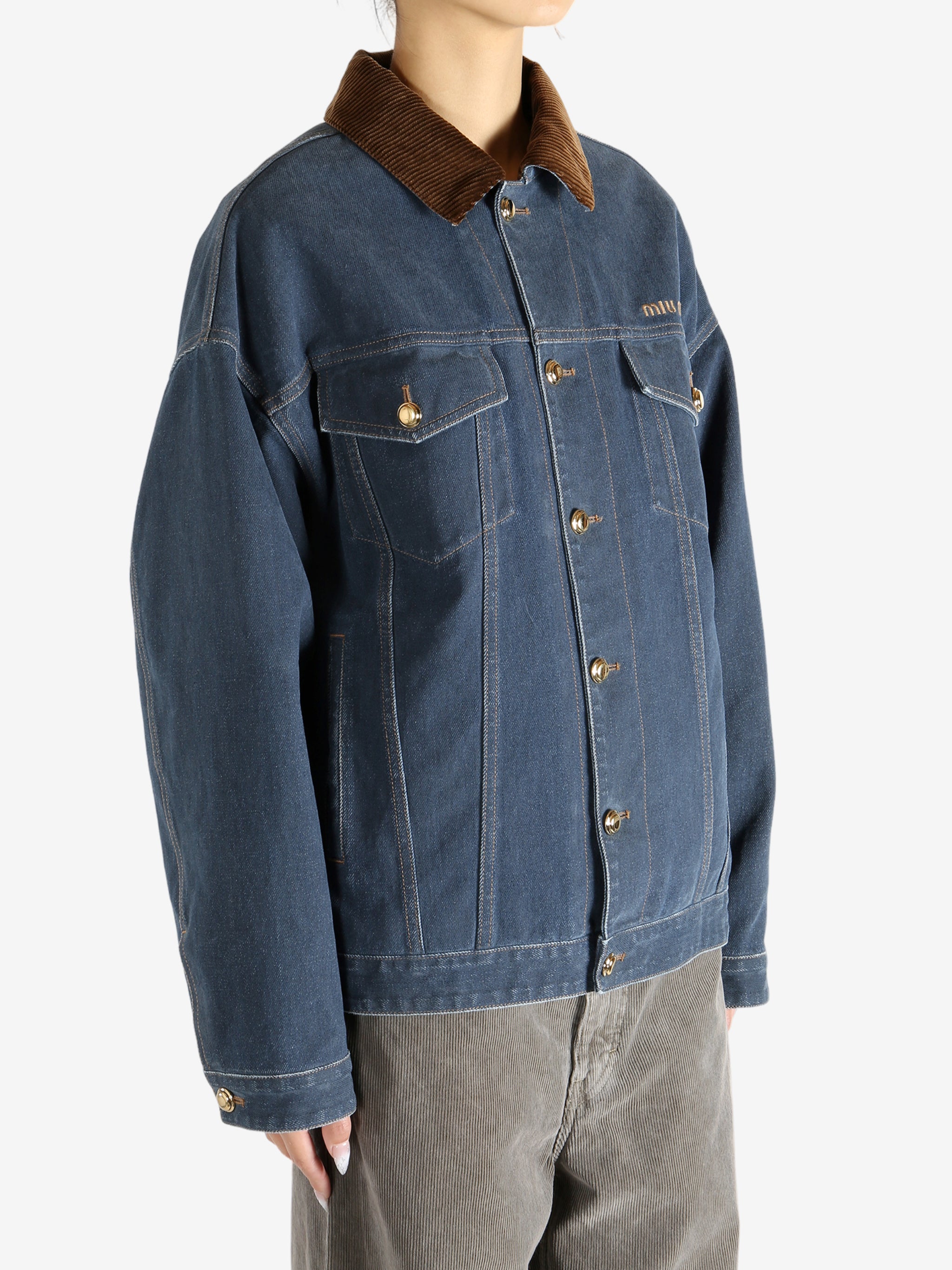 Blue jacket worn by a person, showing the jacket's fit