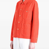 Orange jacket worn by a person, showing the jacket fit