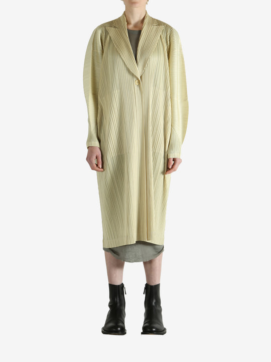 Yellow coat worn by a person, showing the coat's fit