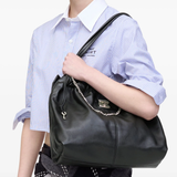Black bag worn by a person, showing the bag's fit