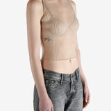 beige ribbed tank top worn by a person, showing the top fit