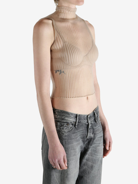 beige ribbed tank top worn by a person, showing the top fit