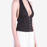 Black top worn by a person, showing the top fit