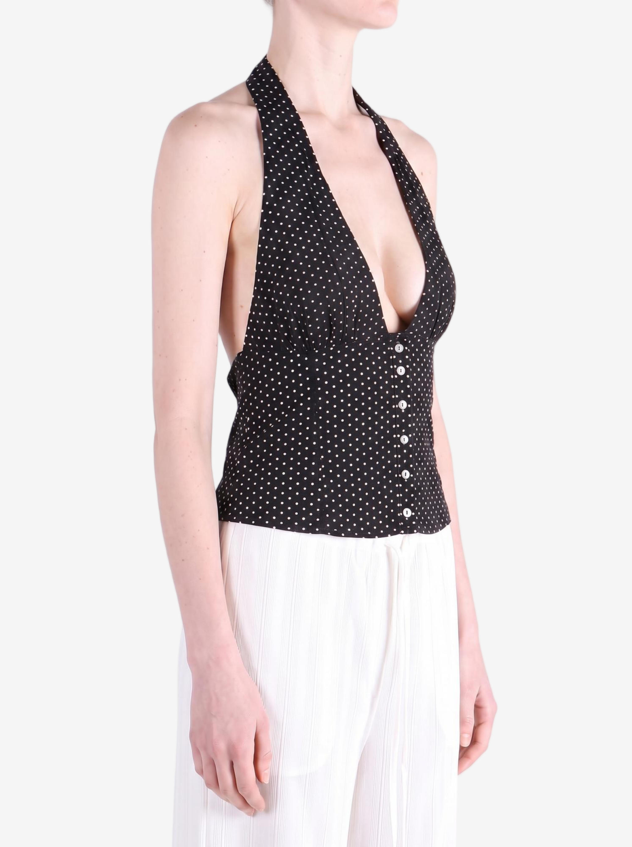 Black top worn by a person, showing the top fit