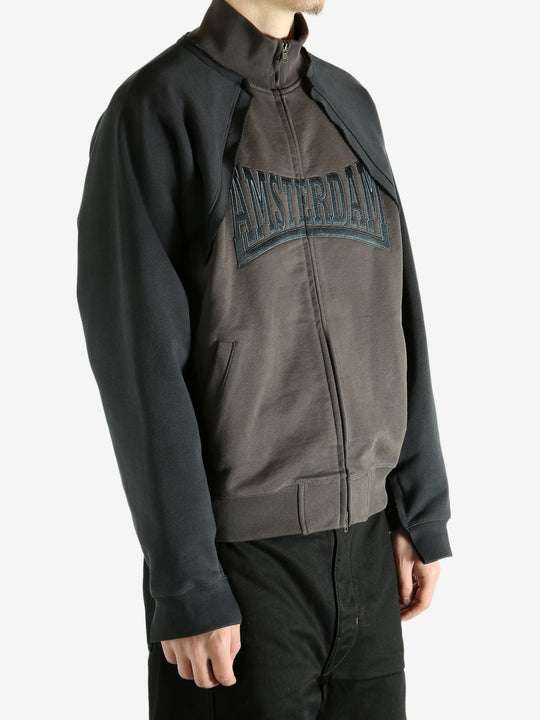 Brown jacket worn by a person, showing the jacket's fit