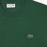 Close up of the green t-shirt, showing texture of the cotton fabric