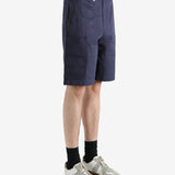 Navy shorts worn by a person, showing the shorts fit