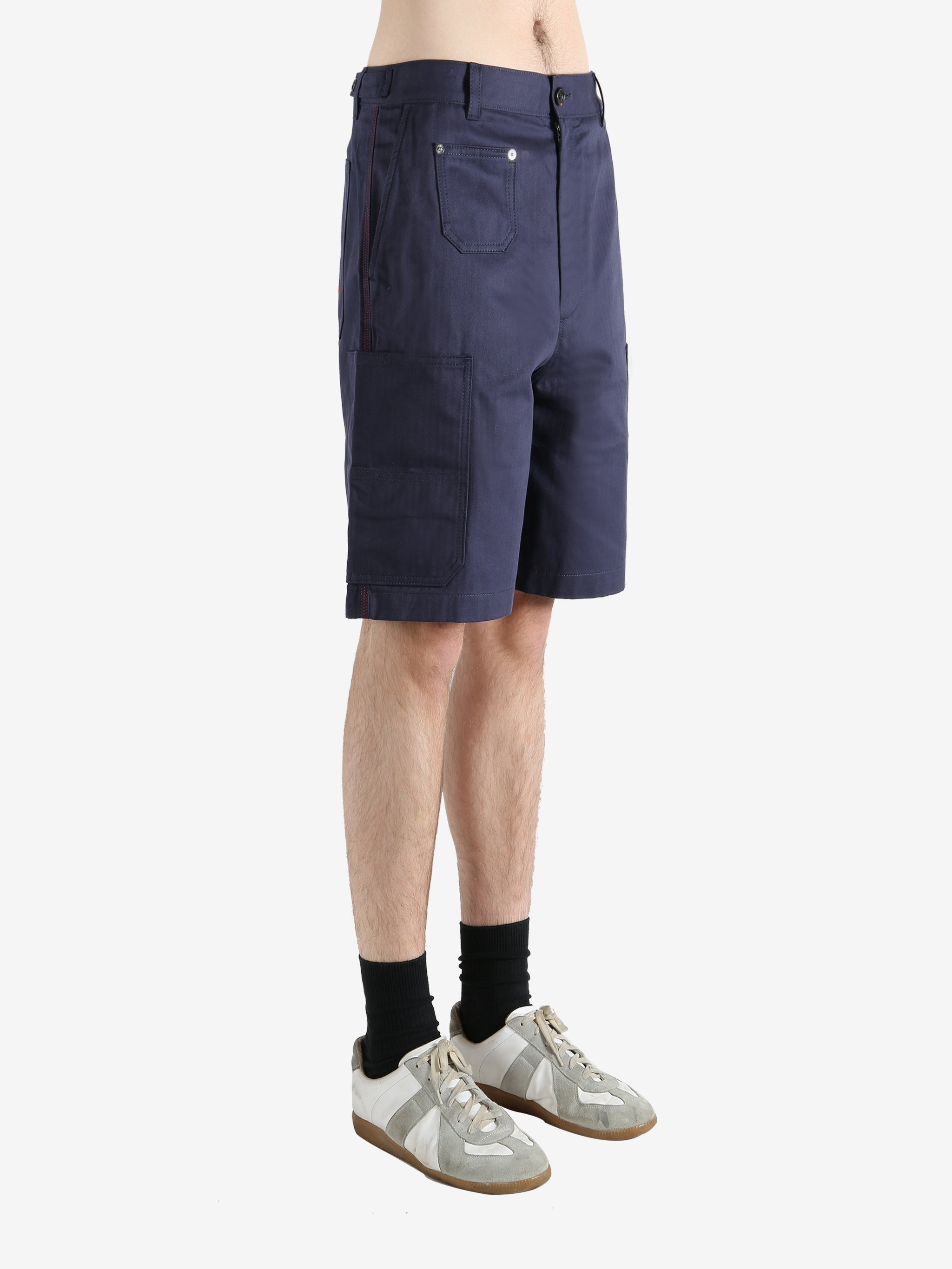 Navy shorts worn by a person, showing the shorts fit