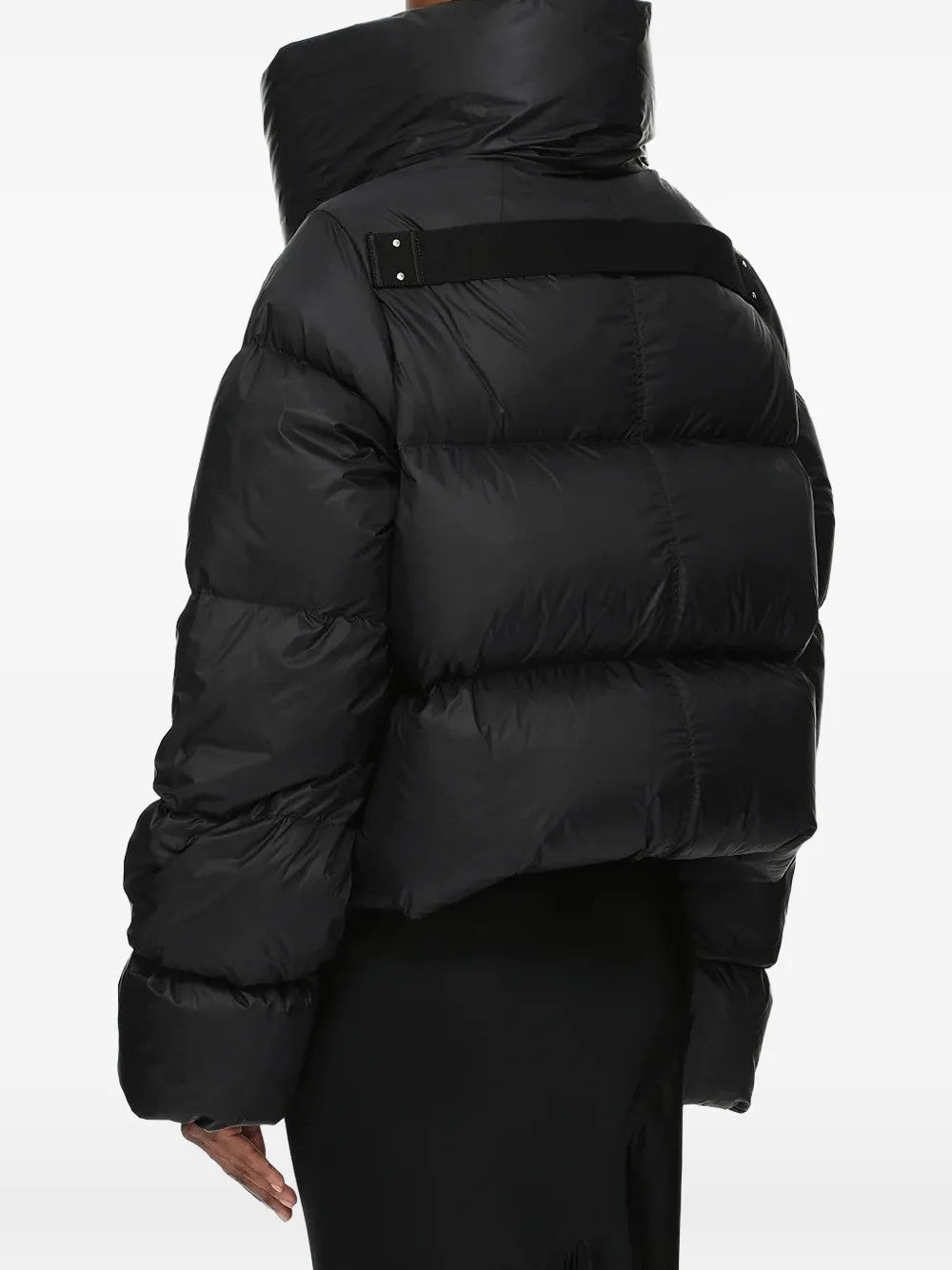 Black jacket worn by a person, showing the jacket fit