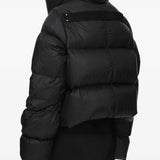 Black jacket worn by a person, showing the jacket fit