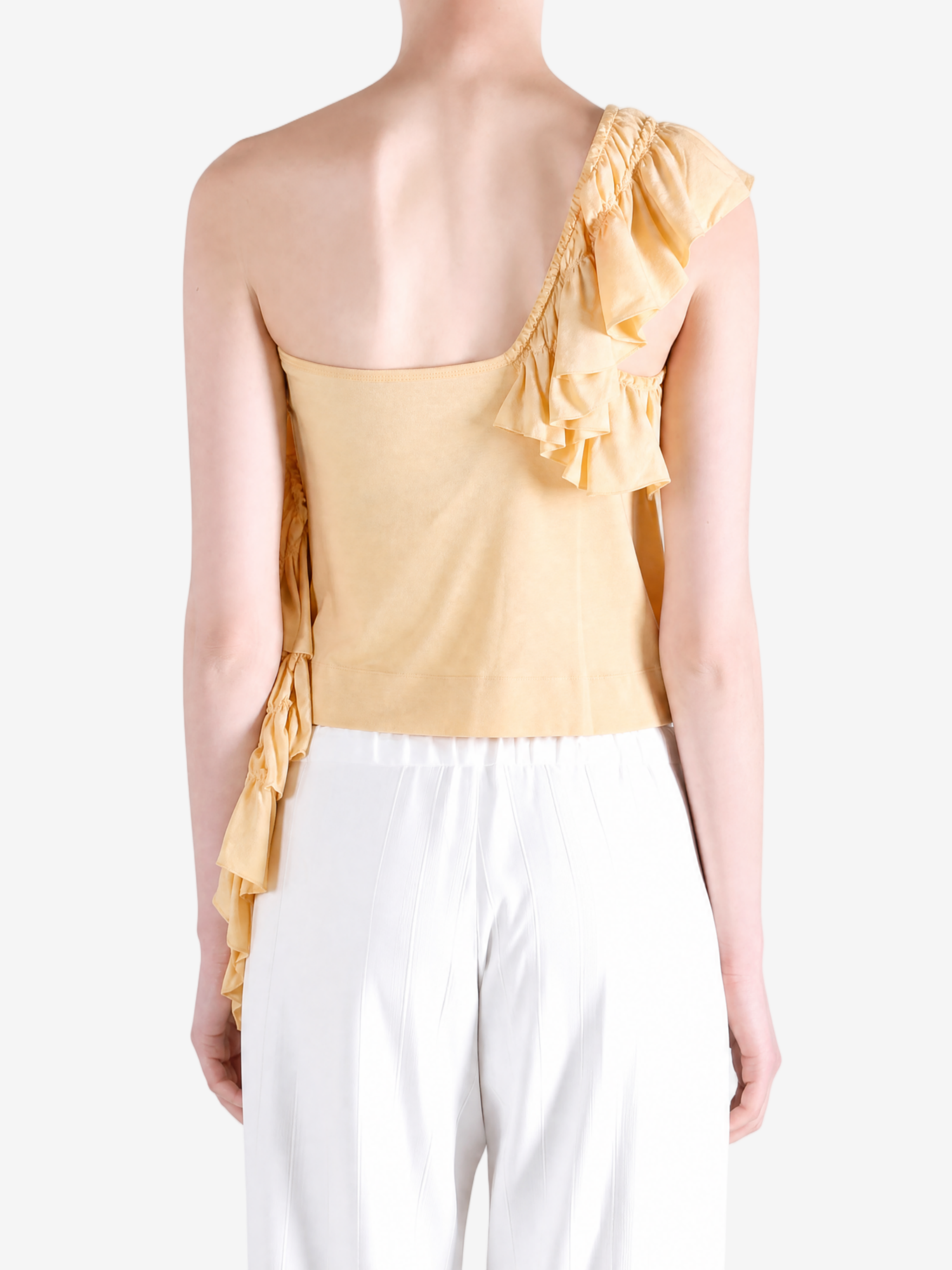 Yellow top worn by a person, showing the top fit