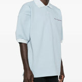Blue top worn by a person, showing the top fit