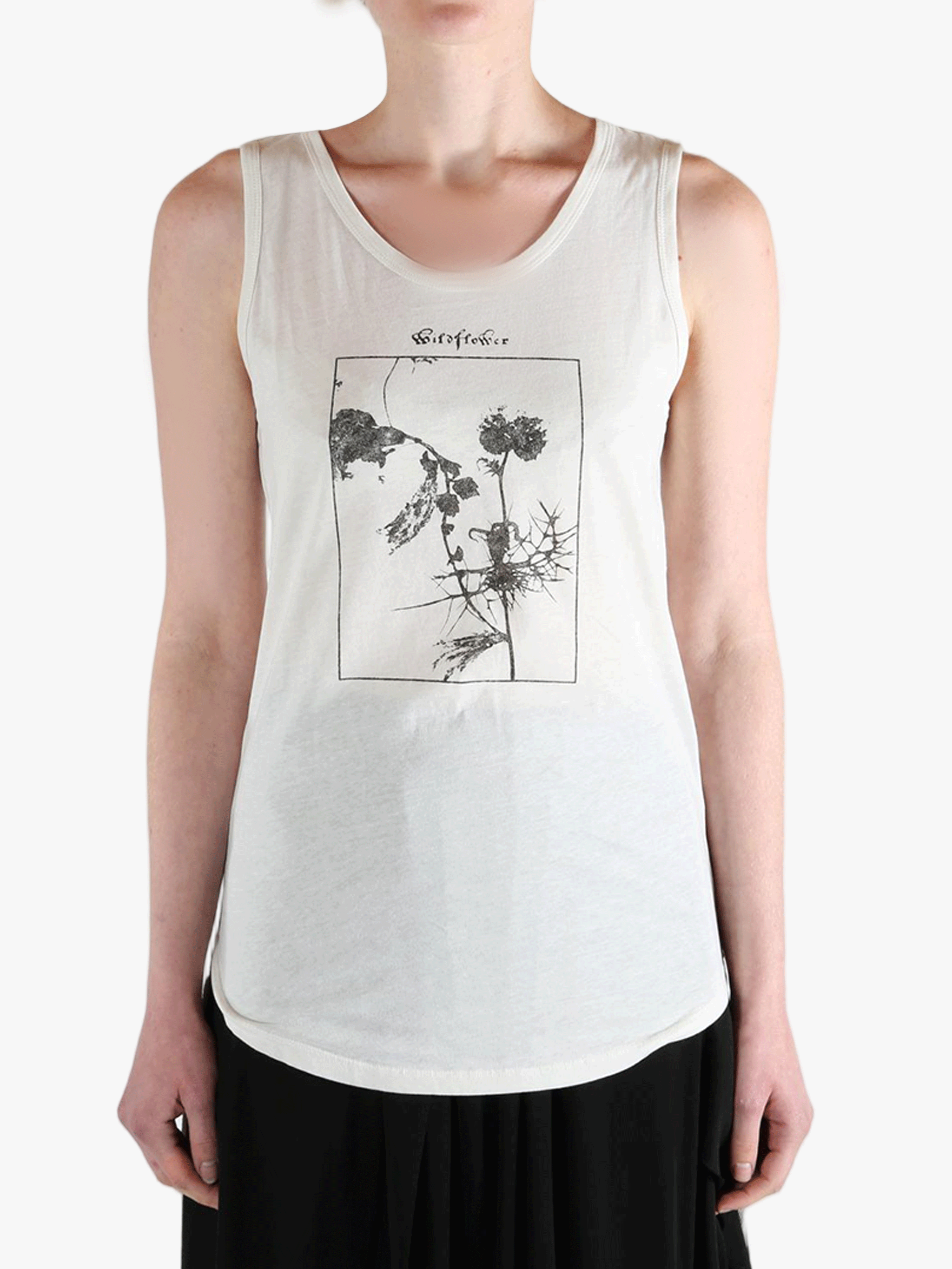 White top worn by a person, showing the top's fit