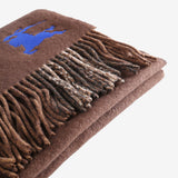 Close up of brown scarves, showing texture of the fabric