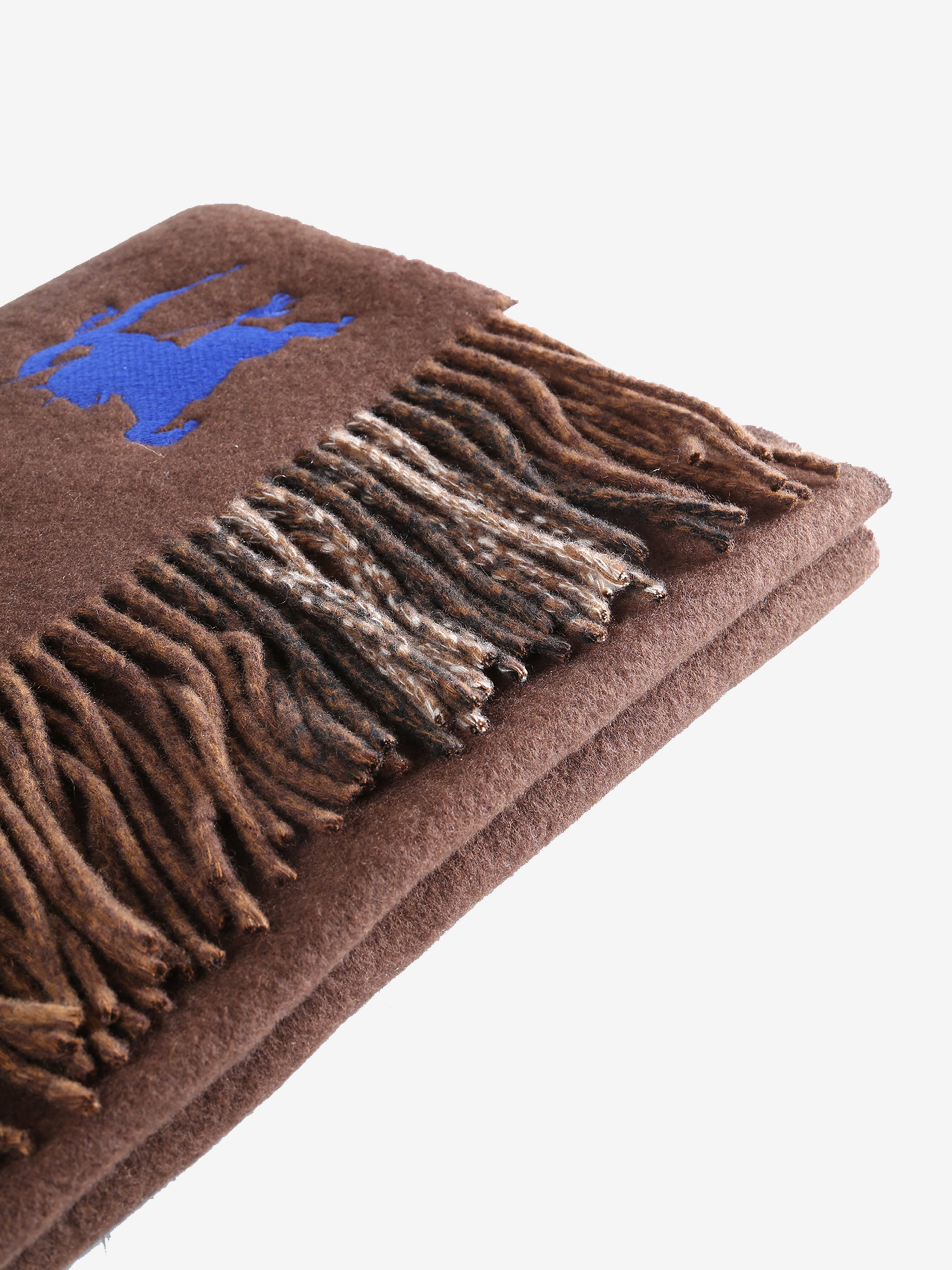 Close up of brown scarves, showing texture of the fabric