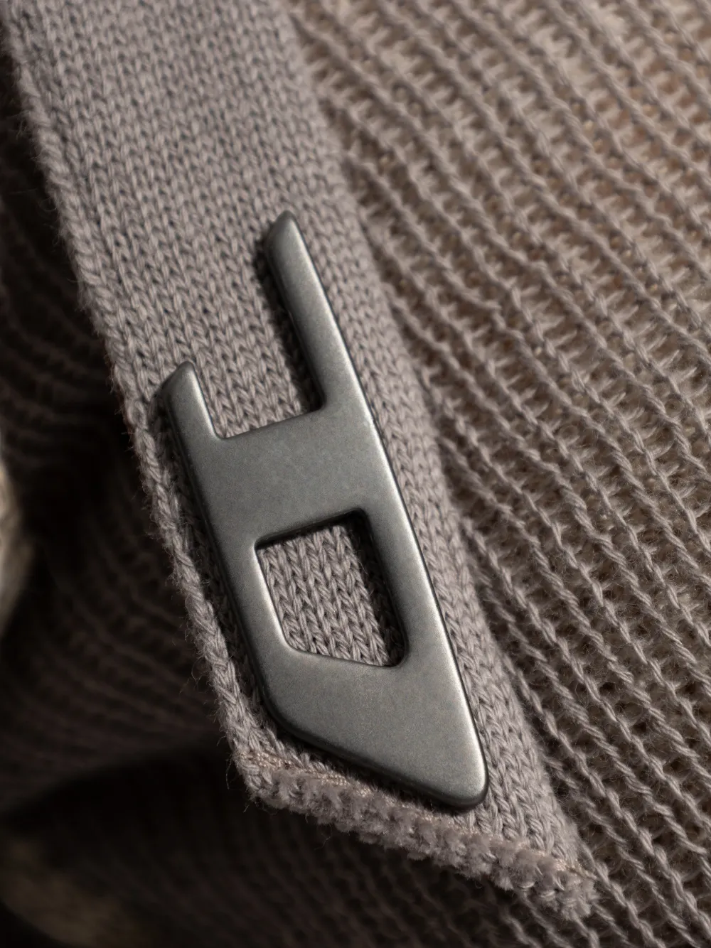 Close up of grey top, showing texture of the cotton fabric