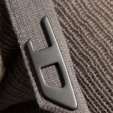 Close up of grey top, showing texture of the cotton fabric